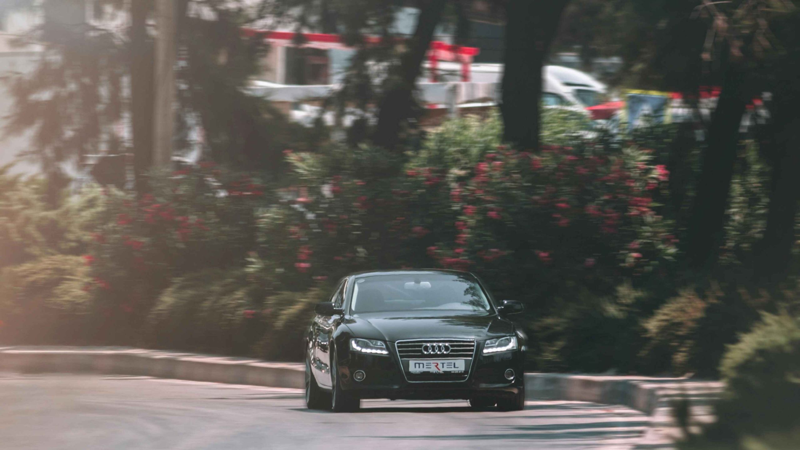 Black Car Driving on Asphalt Road
