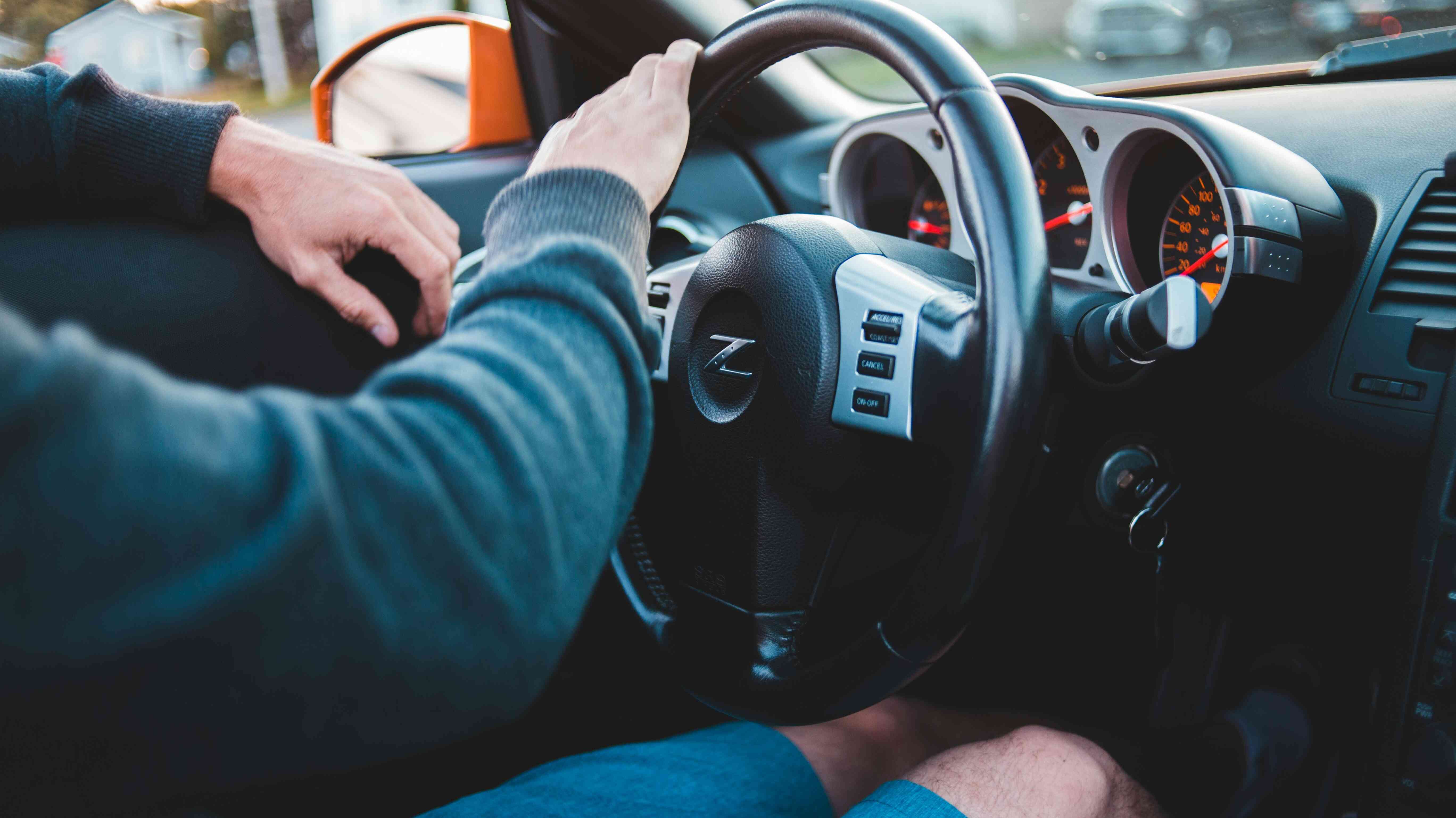 Man driving a car in comfortable interior