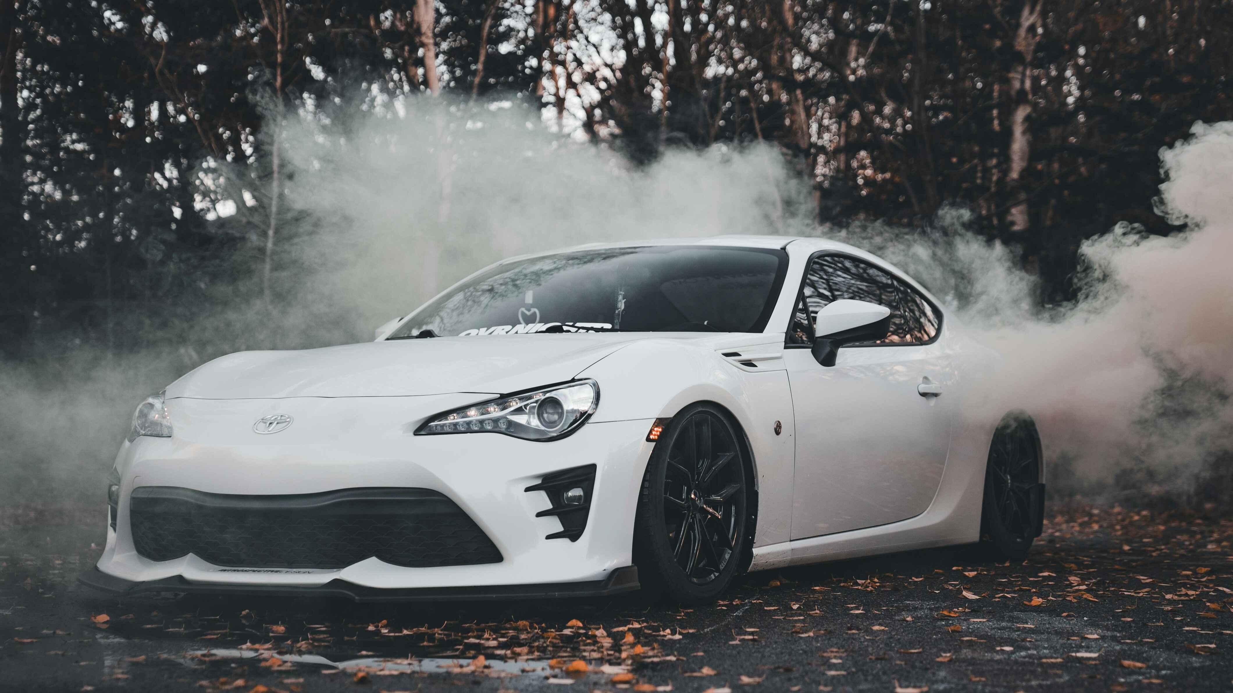 White Sports Car Drifting in Autumn Smoke 