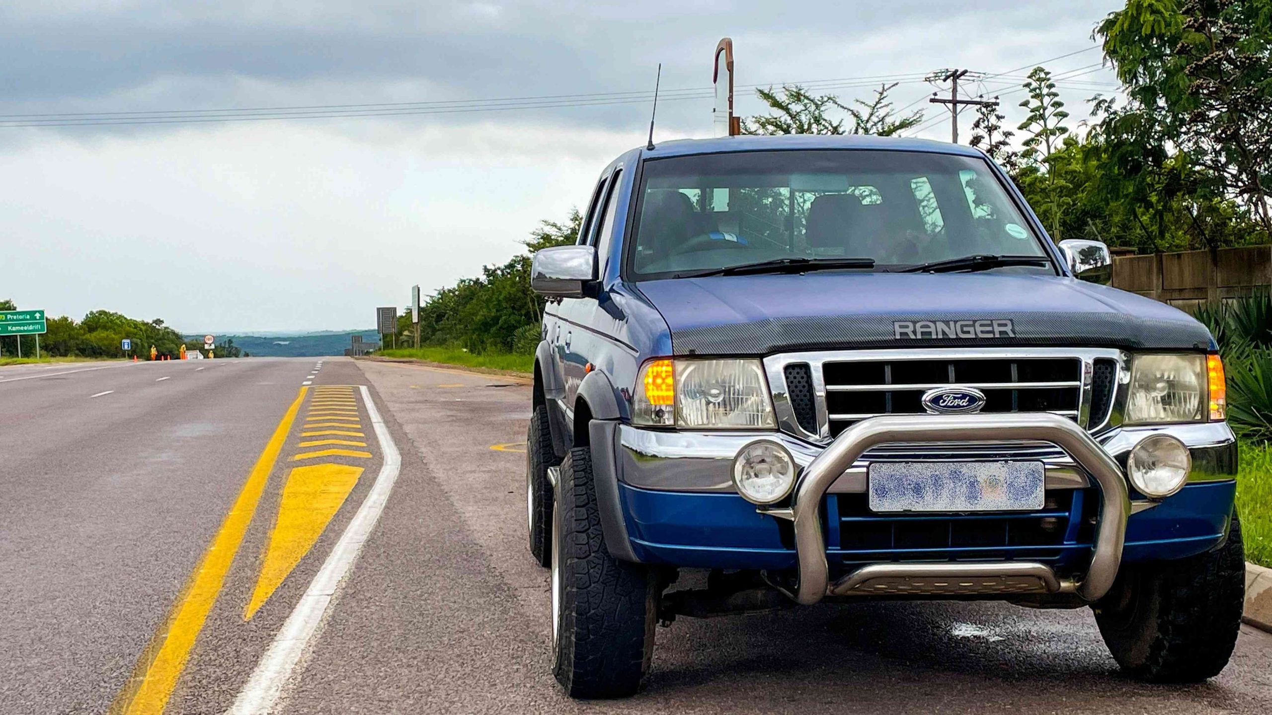A Pickup Truck Parked by the Roadside